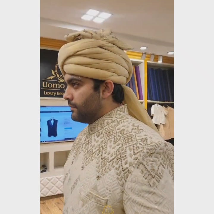 Load and play video in Gallery viewer, Luxurious Beige Sherwani Set for Groom with Embellished Turban and Maroon Shawl