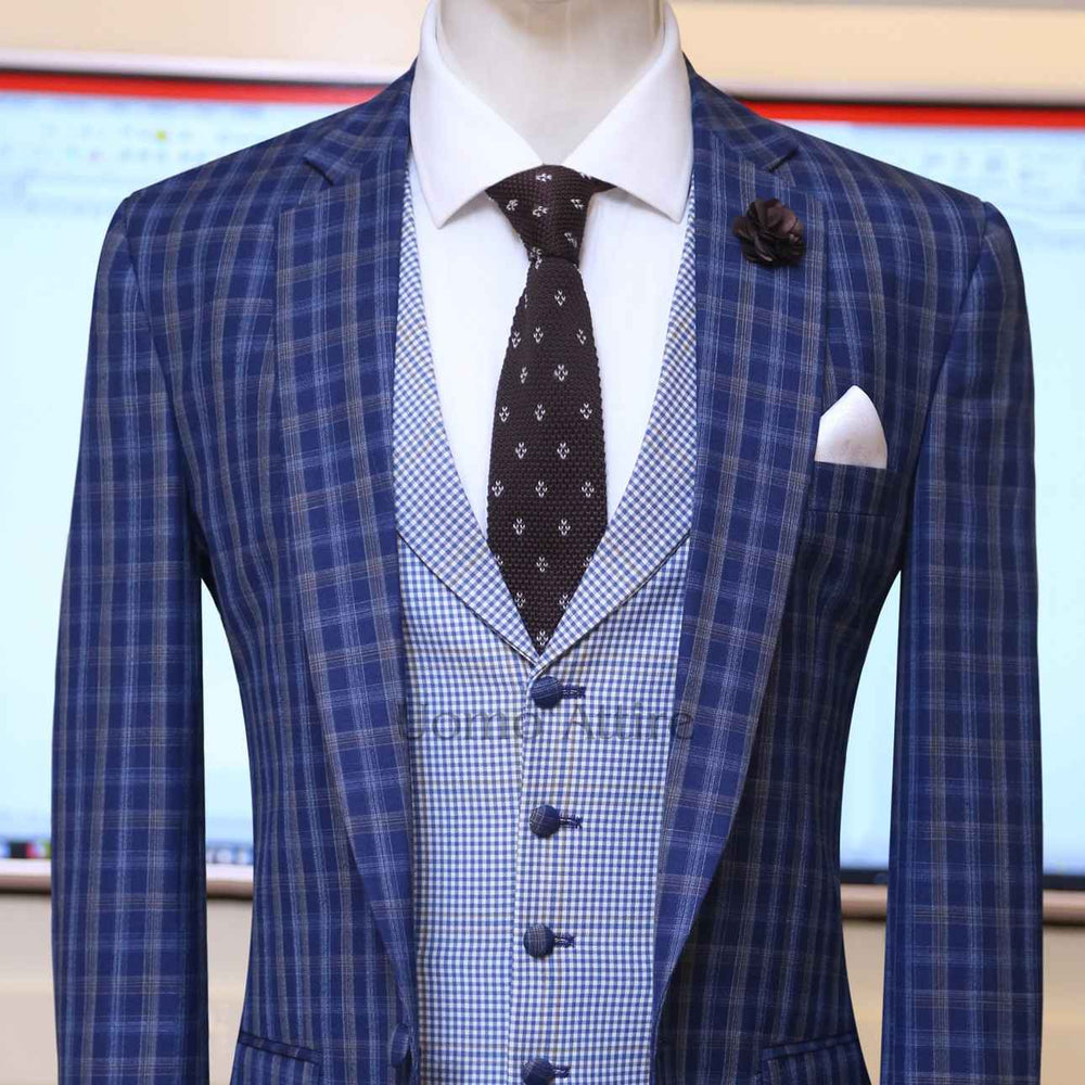 
                  
                    Contrast blue check three piece suit with single breasted vest
                  
                
