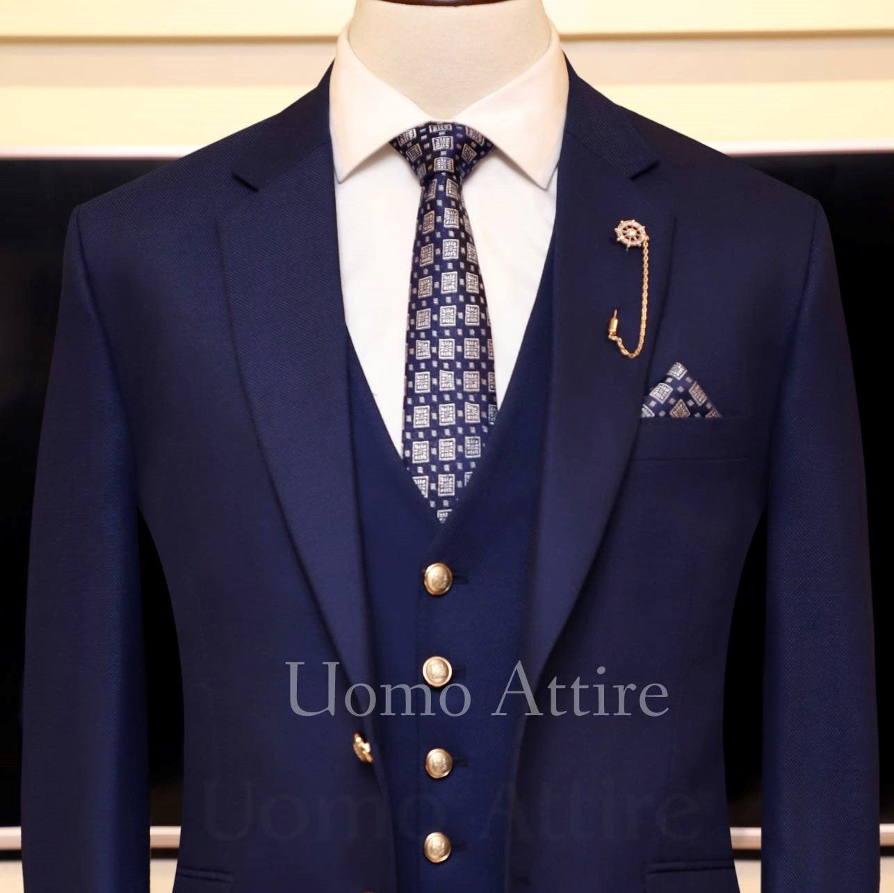deep ink blue customized three piece suit with single breasted vest and designer tie