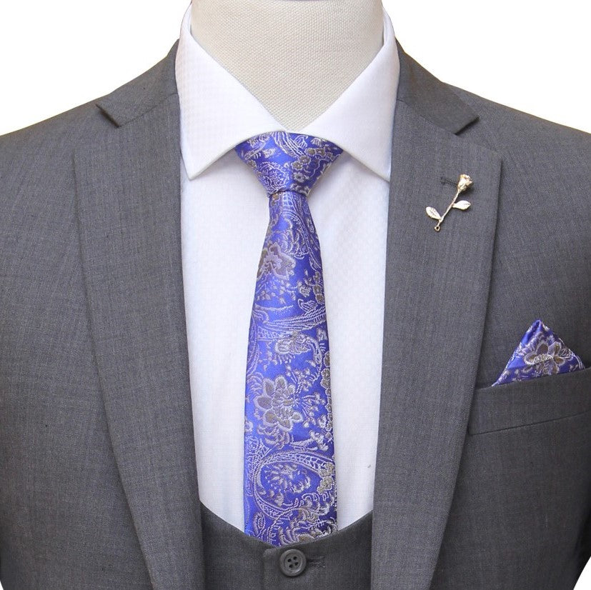 gray bespoke 3 piece suit with single breasted vest and self desing formal tie and pocket sqaure with lapel pin