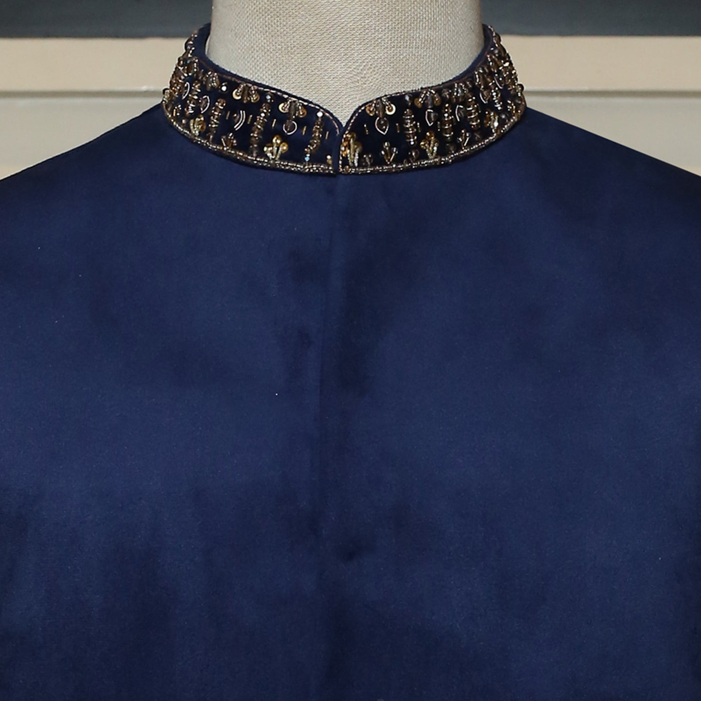 
                  
                    Blue velvet waistcoat with 9K microns golden embellishment
                  
                