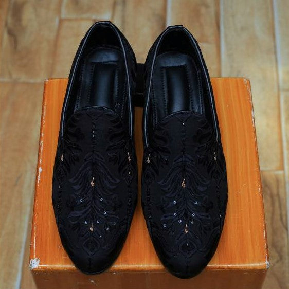 Black sherwani for groom with same fabric shoes