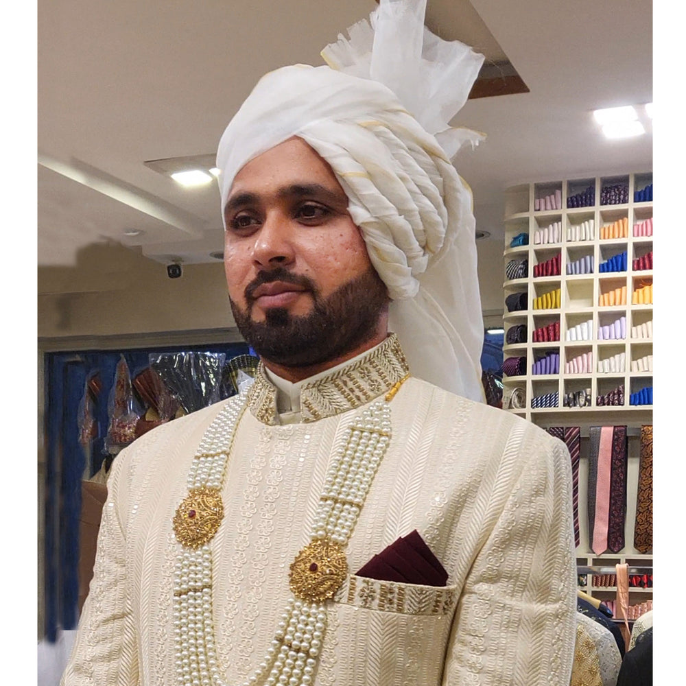 
                  
                    Designer Ivory Wedding Sherwani for Groom | Faheem Ashraf
                  
                