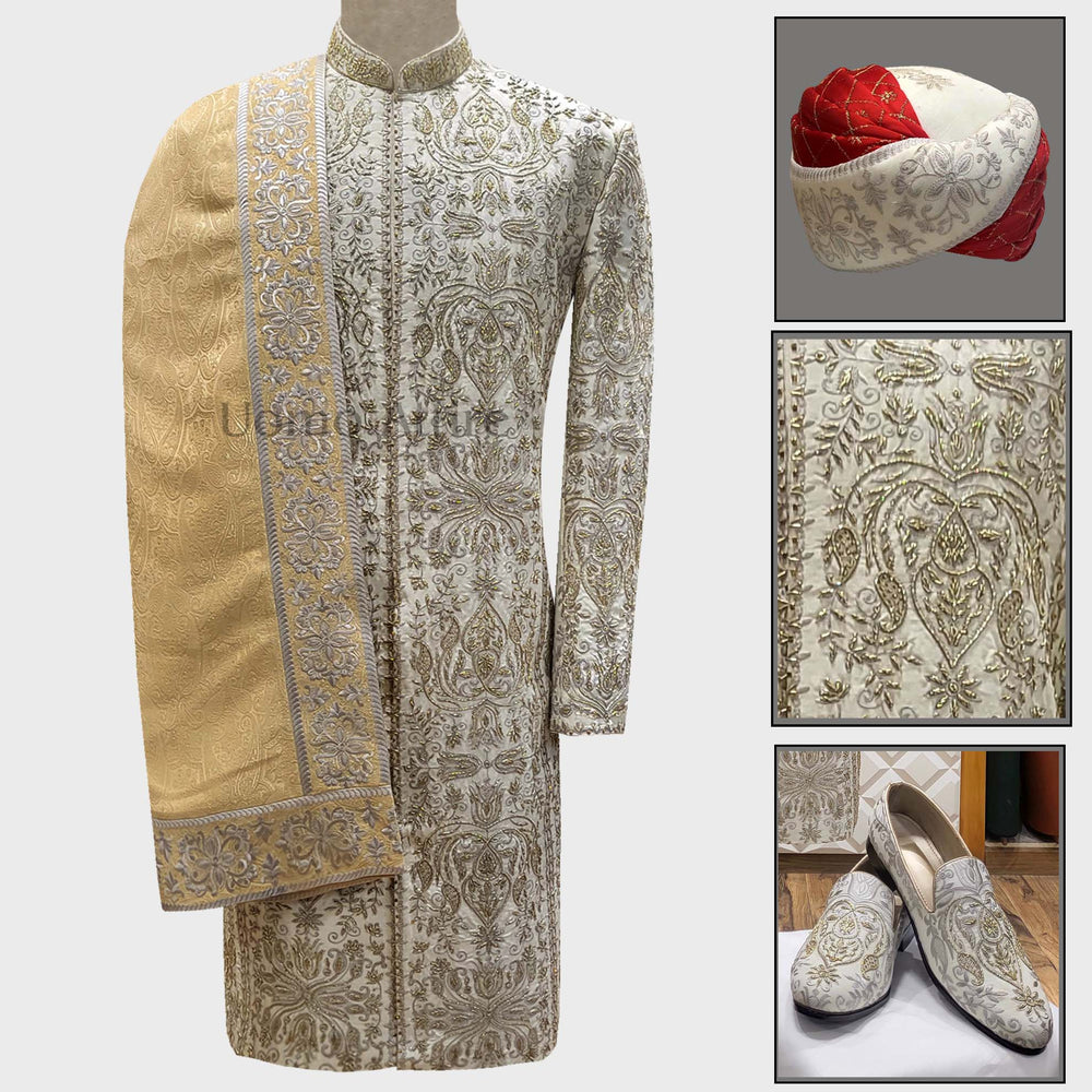Luxury Off-White Men's Wedding Sherwani For Groom: Make a lasting impression on your big day with this stunning Sherwani, crafted from high-quality fabric and featuring intricate embroidery. Includes a matching turban, shoes and shawl.