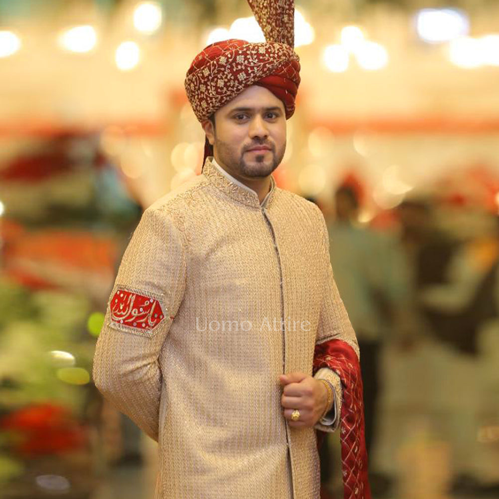 
                  
                    Luxury Custom-Made Beige Sherwani for Groom with Full Embellishments and Maroon Turban
                  
                