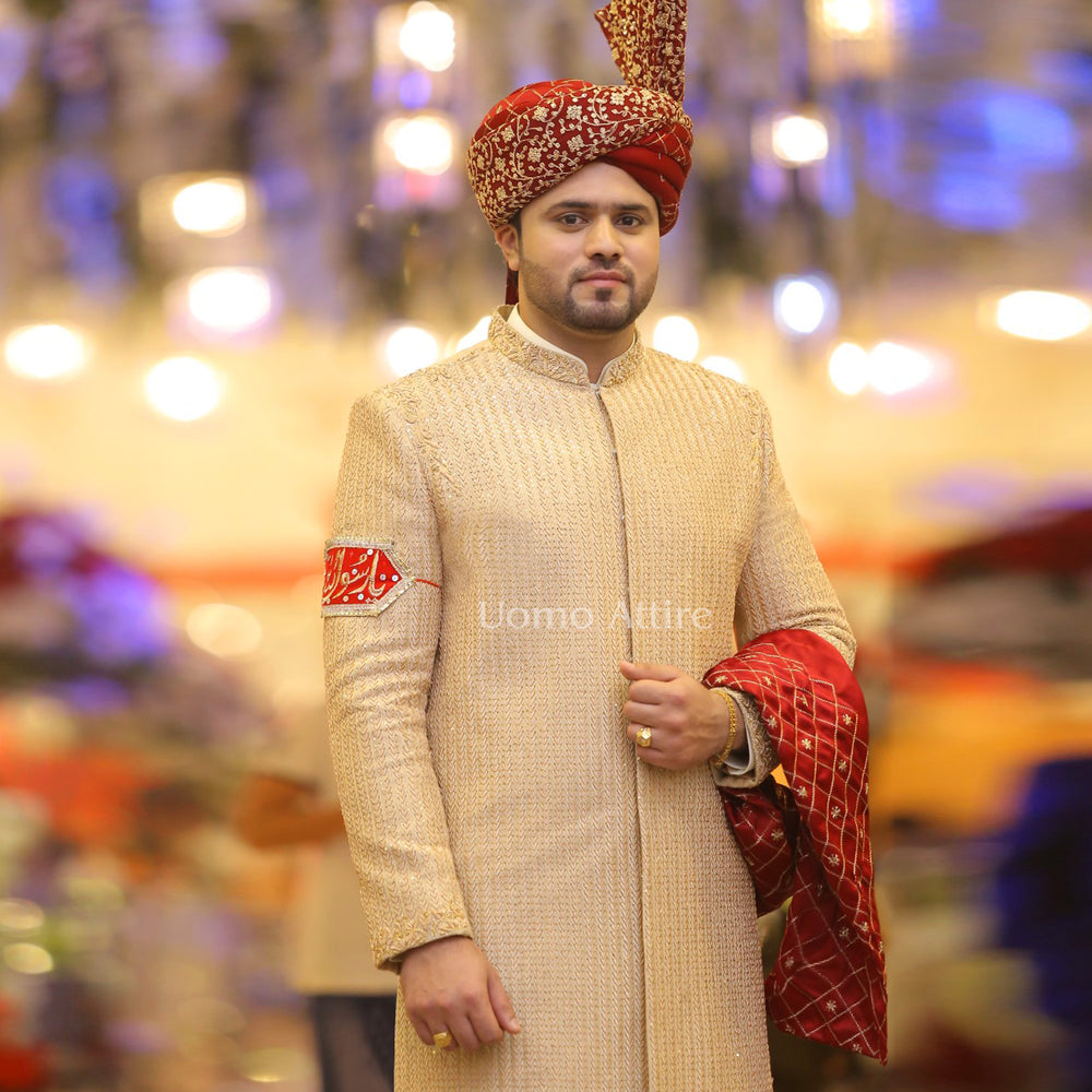 
                  
                    Luxury Custom-Made Beige Sherwani for Groom with Full Embellishments and Maroon Turban
                  
                