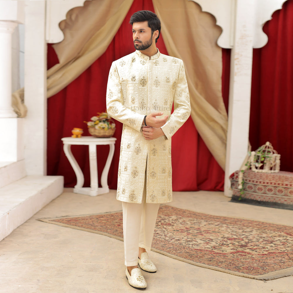 
                  
                    Luxurious Cream and Gold Embroidered Sherwani Ensemble for the Groom
                  
                