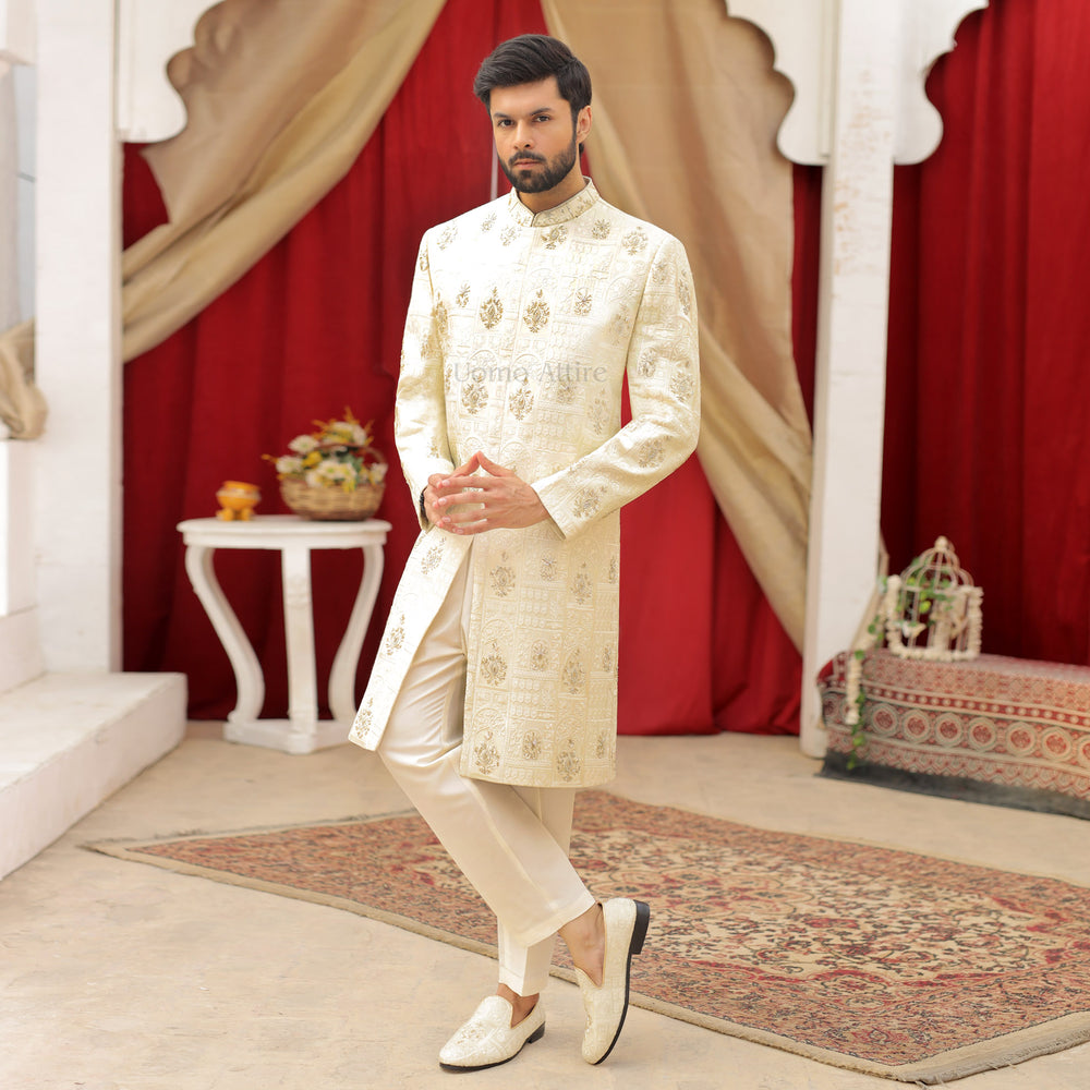 
                  
                    Luxurious Cream and Gold Embroidered Sherwani Ensemble for the Groom
                  
                