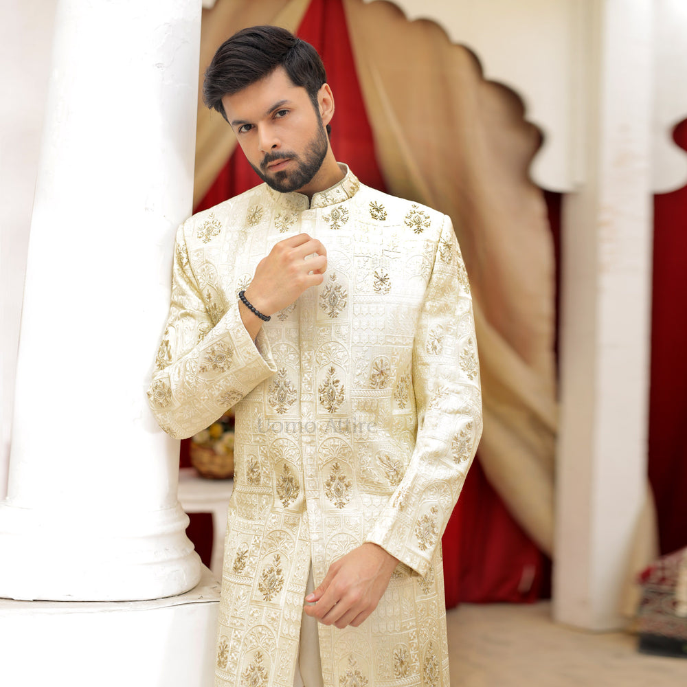 
                  
                    Luxurious Cream and Gold Embroidered Sherwani Ensemble for the Groom
                  
                