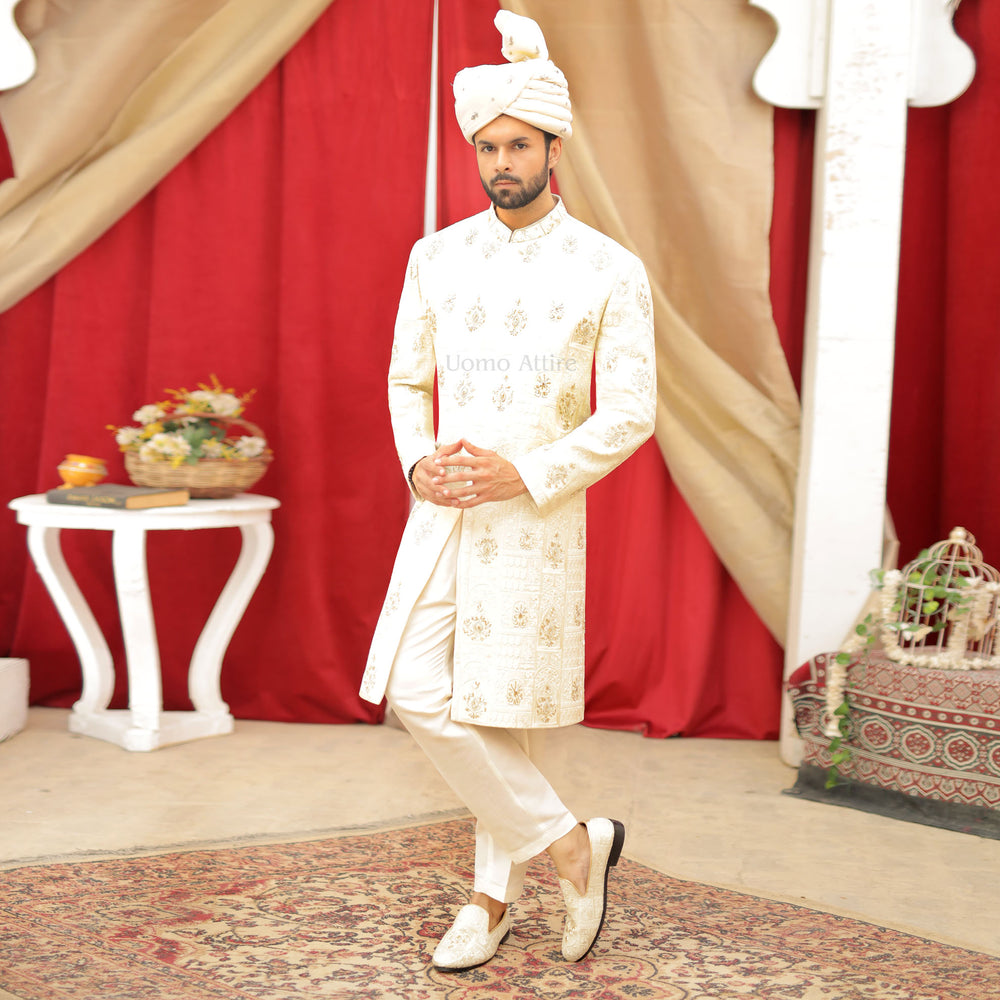 
                  
                    Luxurious Cream and Gold Embroidered Sherwani Ensemble for the Groom
                  
                