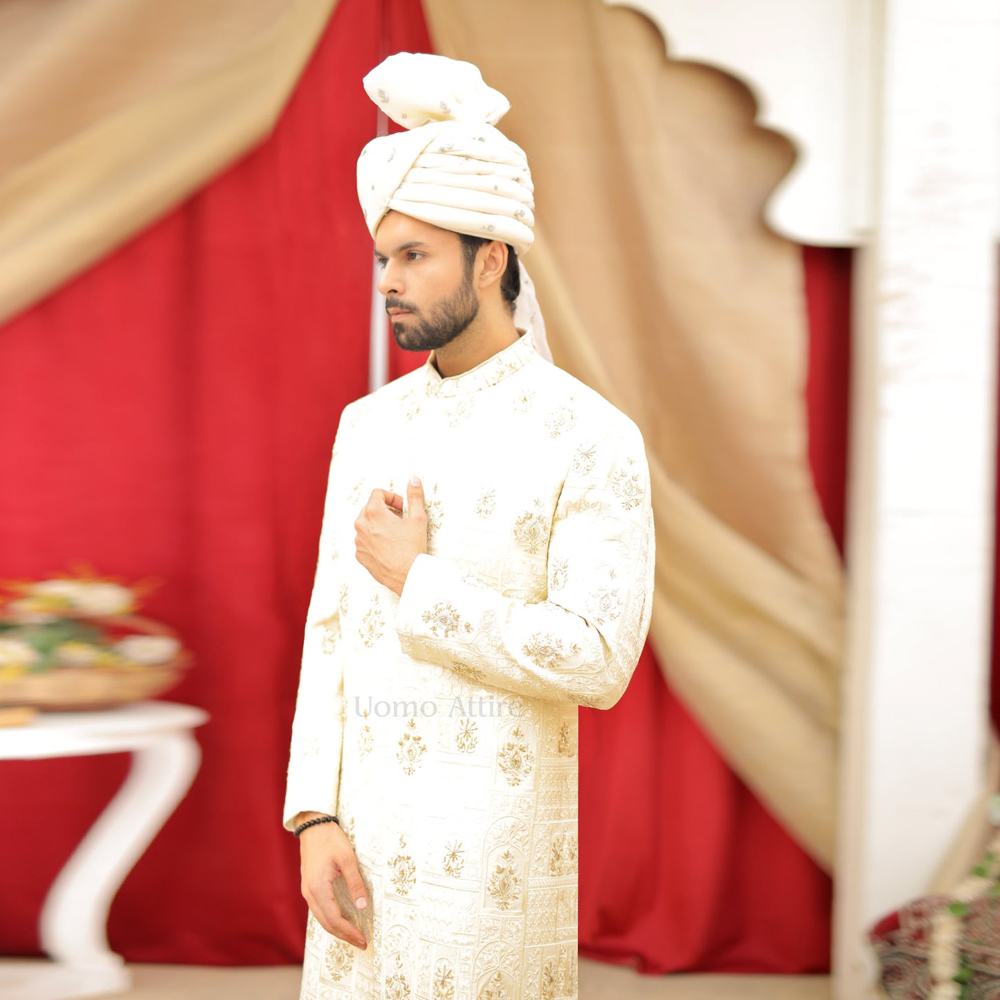 
                  
                    Luxurious Cream and Gold Embroidered Sherwani Ensemble for the Groom
                  
                