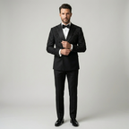 Man wearing a black tuxedo with a bow tie on a plain background | Bespoke Black Double Breasted Tuxedo Jacket with Leaf Embroidery