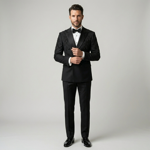 Man wearing a black tuxedo with a bow tie on a plain background | Bespoke Black Double Breasted Tuxedo Jacket with Leaf Embroidery