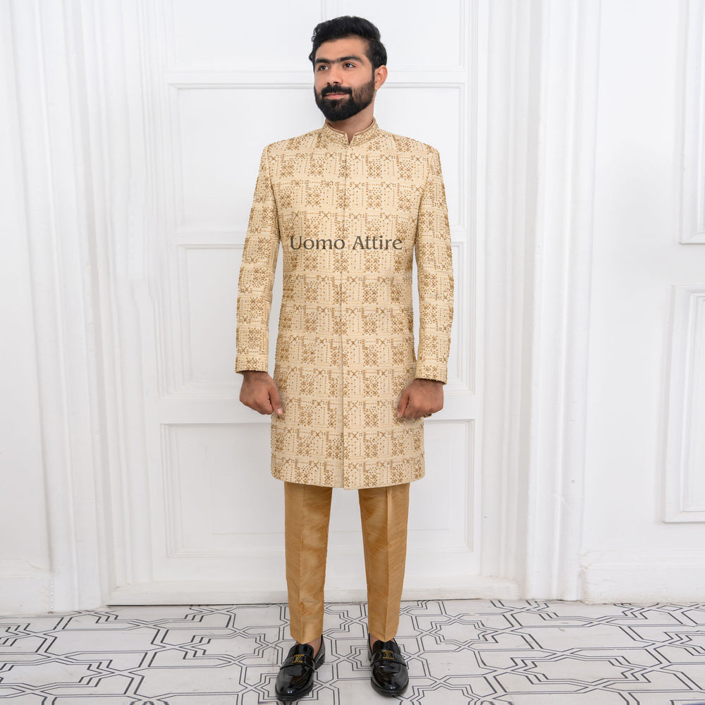 
                  
                    Luxury Golden Sherwani with Full Hand Embellishments and Maroon Kulla for Groom
                  
                