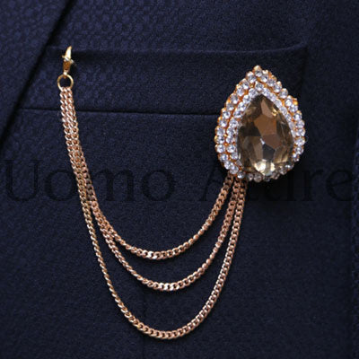 Spilla con catena in pietra diamantata champagne 