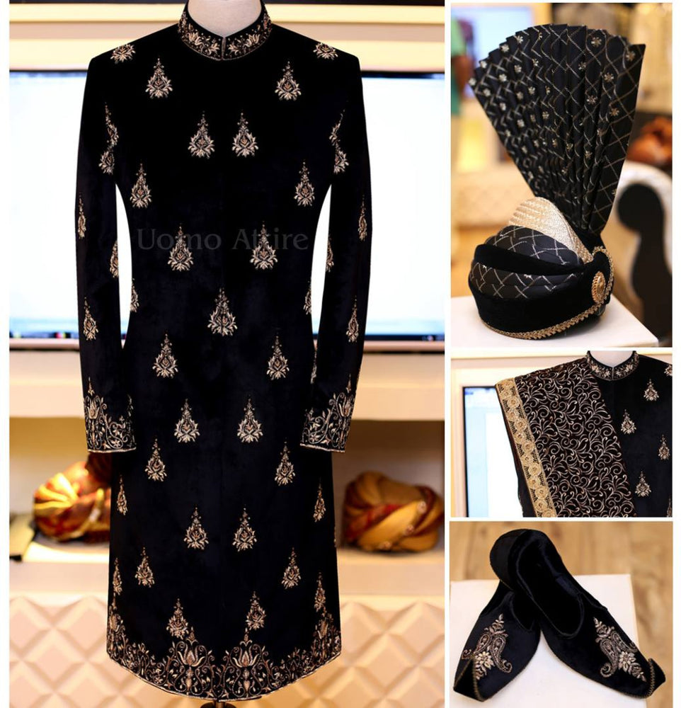 
                  
                    Black sherwani full package adorned with antique gold work
                  
                