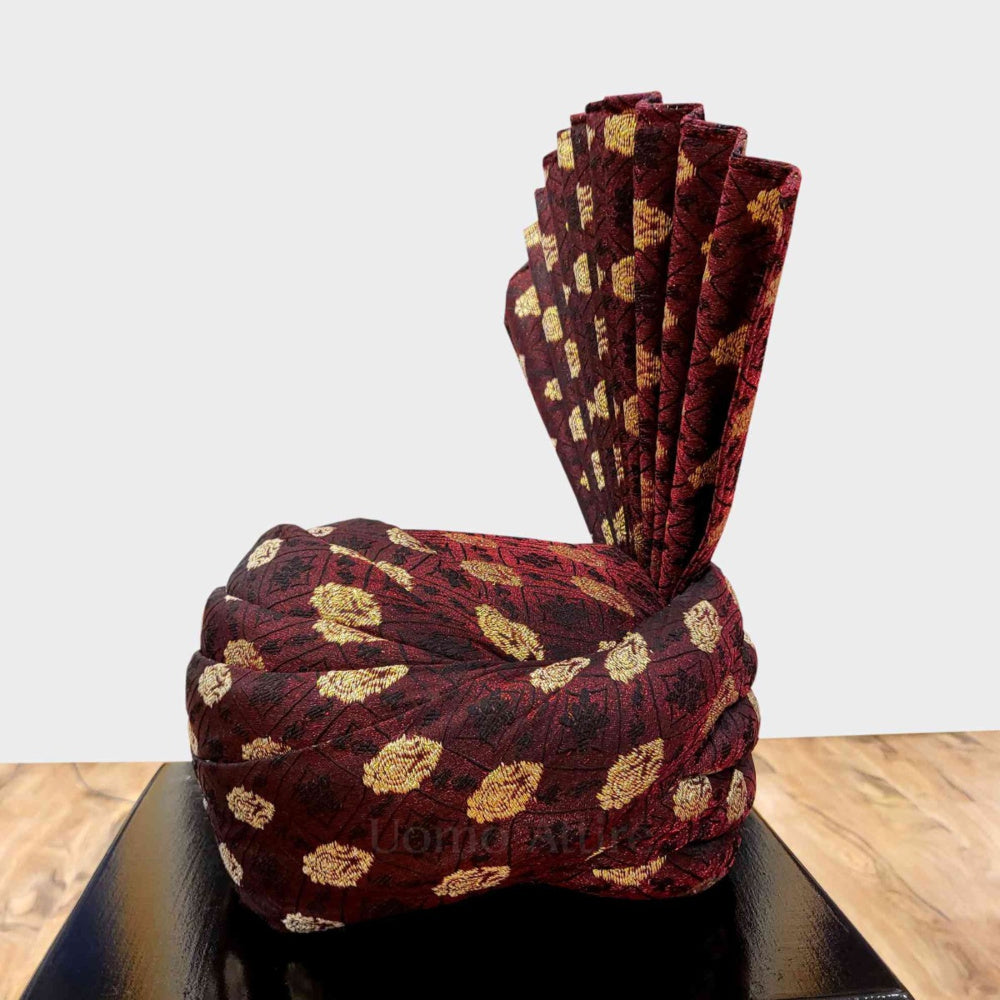 Customized turban for groom in contrast of golden, black and maroon red