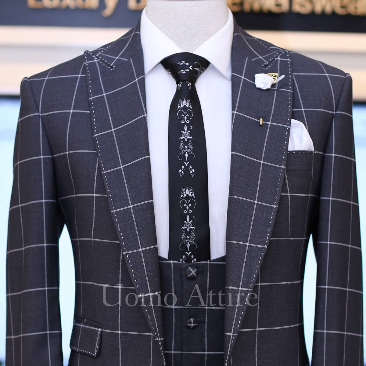 dark grey windowpane check 3 piece suit with single breasted vest and pick stitch