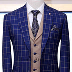 Sharp blue windowpane check three piece suit with single breasted shawl lapel vest