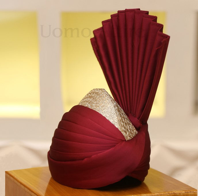 
                  
                    Groom wear wedding golden embellished sherwani matching with maroon turban
                  
                