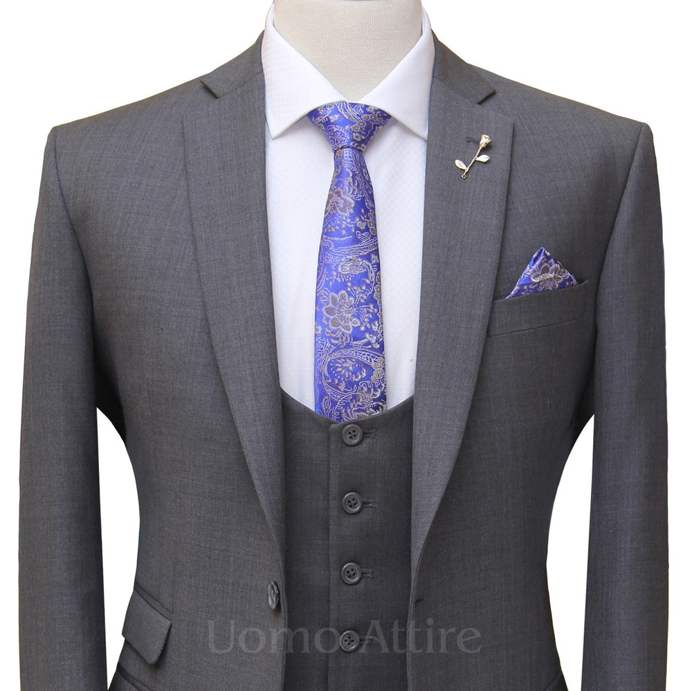 
                  
                    gray bespoke 3 piece suit with single breasted vest and self desing formal tie and pocket sqaure
                  
                