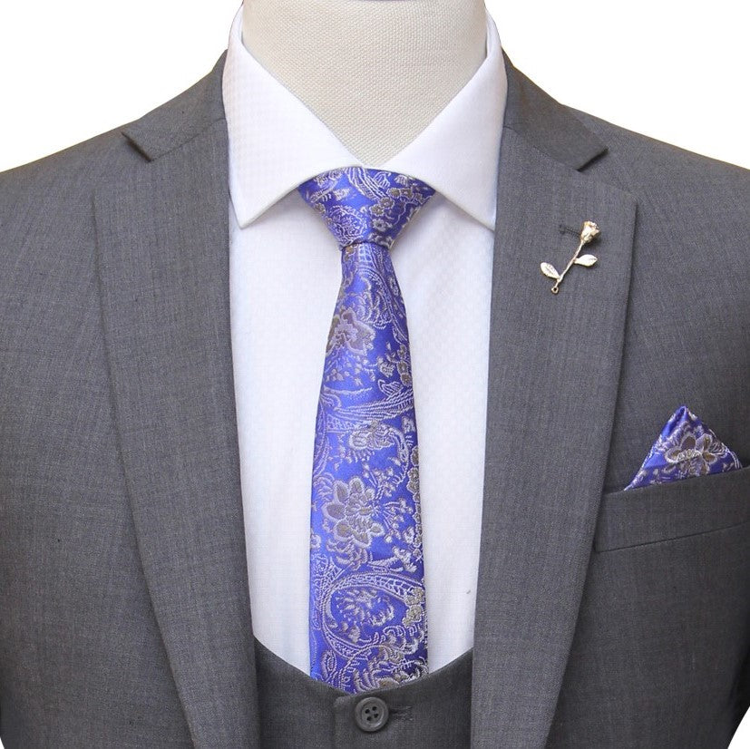 
                  
                    gray bespoke 3 piece suit with single breasted vest and self desing formal tie and pocket sqaure with lapel pin
                  
                