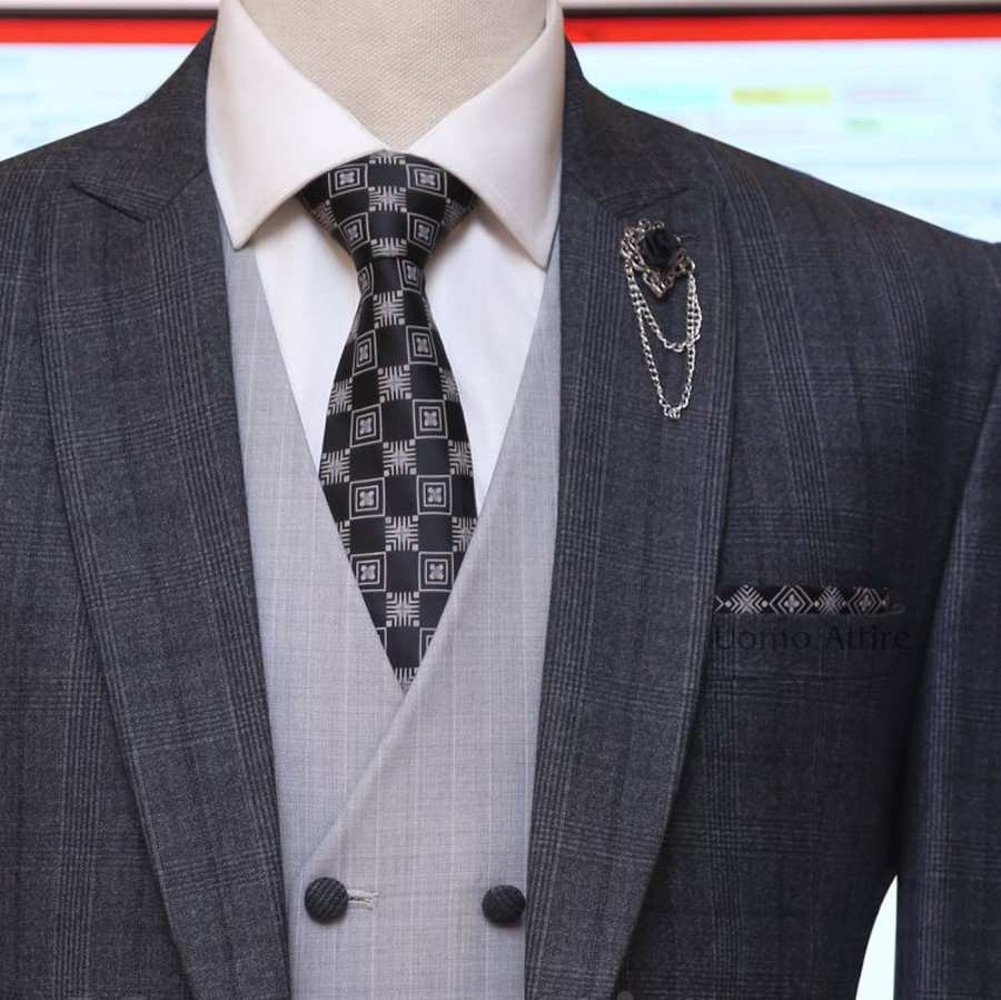 
                  
                    Charcoal grey glen check slim fit three piece suit with double breasted vest
                  
                