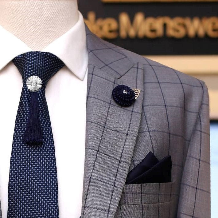 Gray windowpane check 3 piece suit with double breasted blue shawl laple vest, formal tie, pocket sqaure and lapel pin