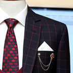 windowpane plain check three piece suit with custom design knitted tie and white pocket square